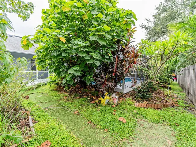 a backyard of a house with lots of green space