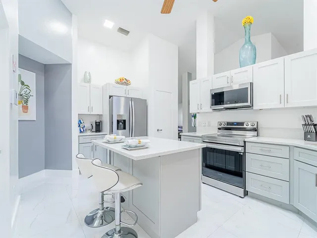 a kitchen with a sink stove and microwave