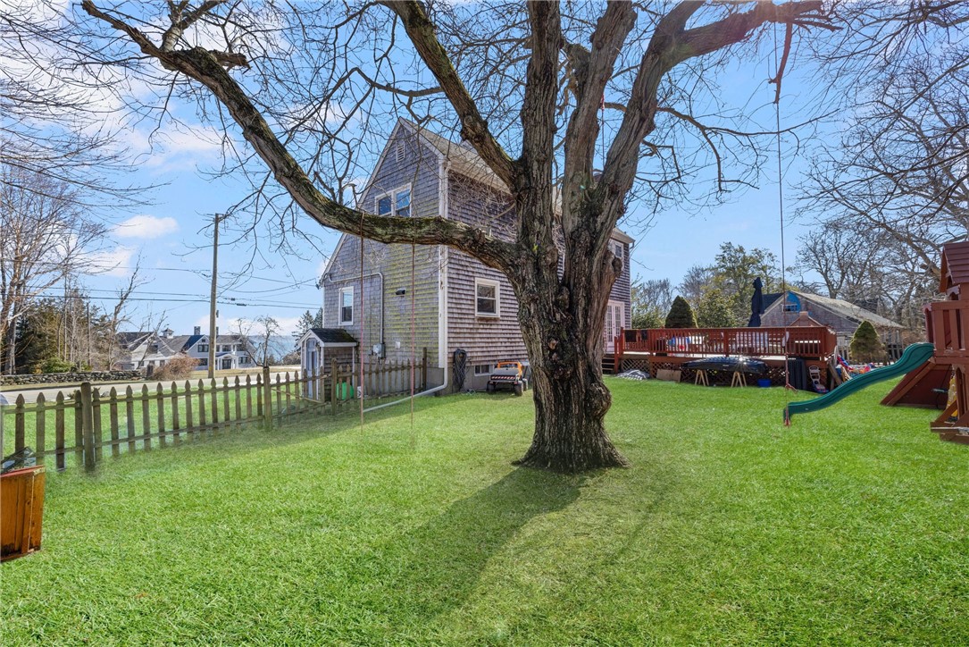 1059 East Shore Road Jamestown, RI 02835 - Photo 3 of 35 Fenced in yard. The swing set and children's play items are the current tenants belongings.