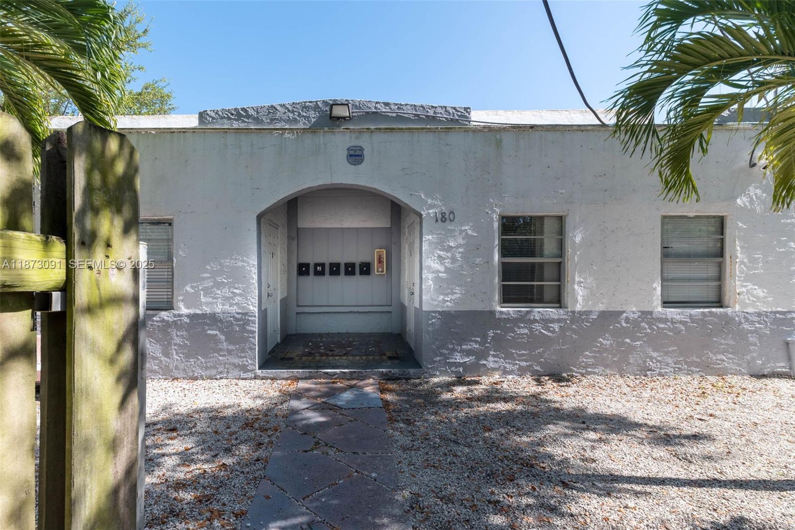 180 Northwest 59th Street Miami, FL 33127 - Photo 2 of 23 a front view of a house