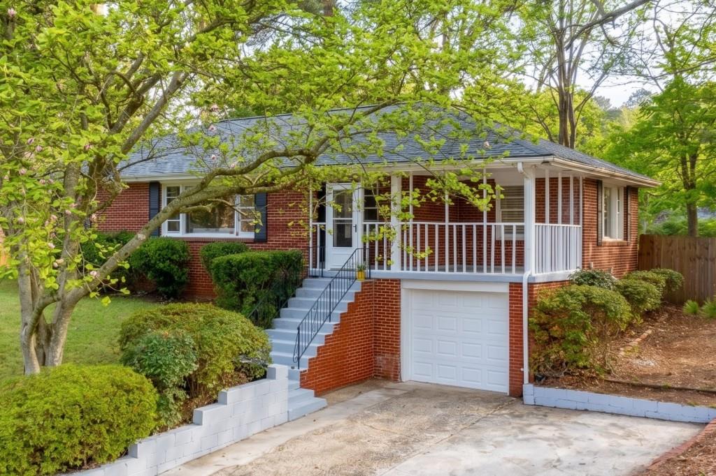 282 Willis Mill Road Southwest Atlanta, GA 30311 - Photo 1 of 18 a view of a house with a yard