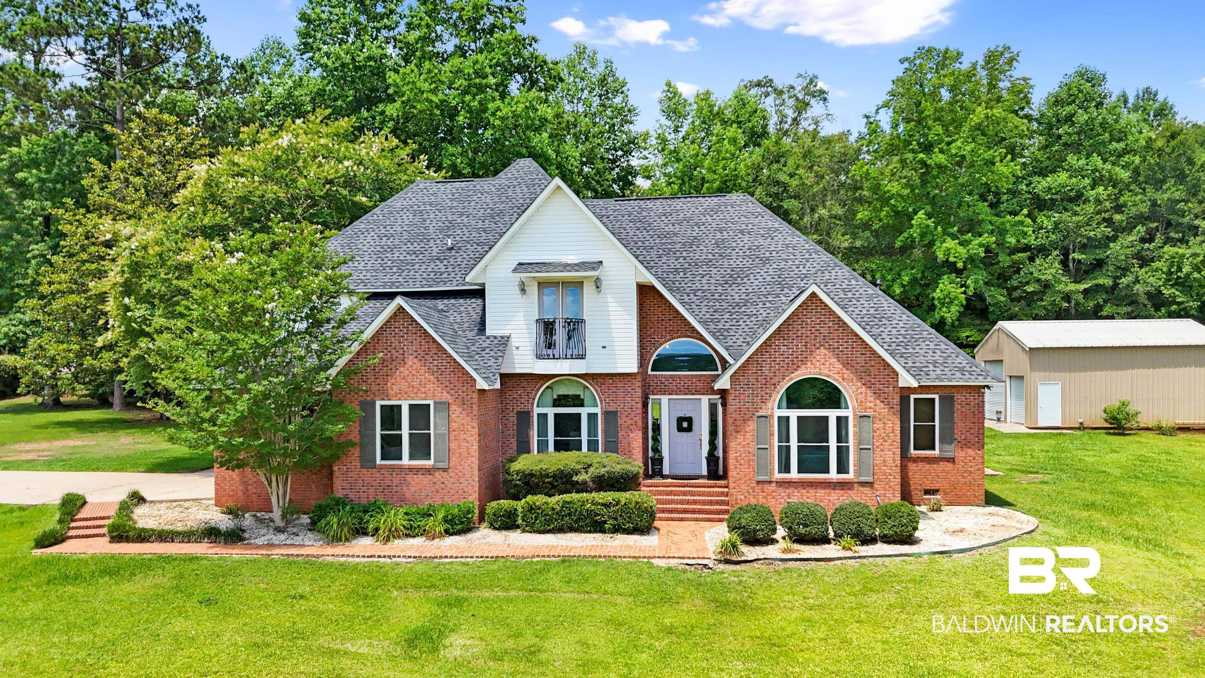 196 Morning Ridge Road Monroeville, AL 36460 - Photo 58 of 71 View of front of house featuring a front lawn, brick siding, and roof with shingles