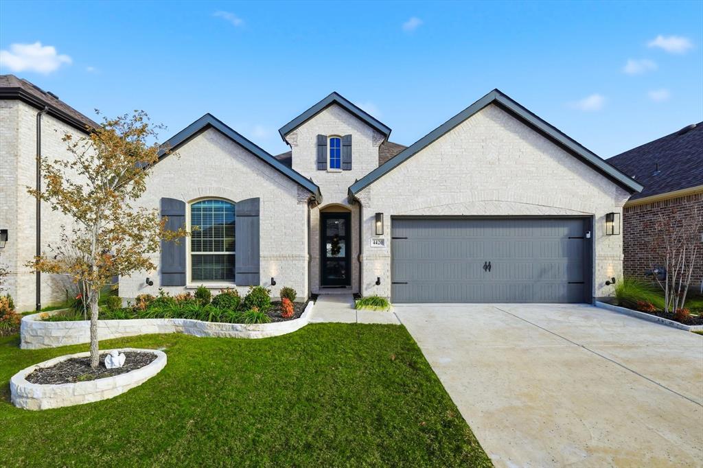 4420 Minnow Cove Oak Point, TX 75068 - Photo 1 of 40 a view of a house with a big yard and a large tree