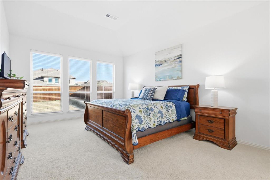 4420 Minnow Cove Oak Point, TX 75068 - Photo 20 of 40 a bed sitting in a spacious bedroom next to a window