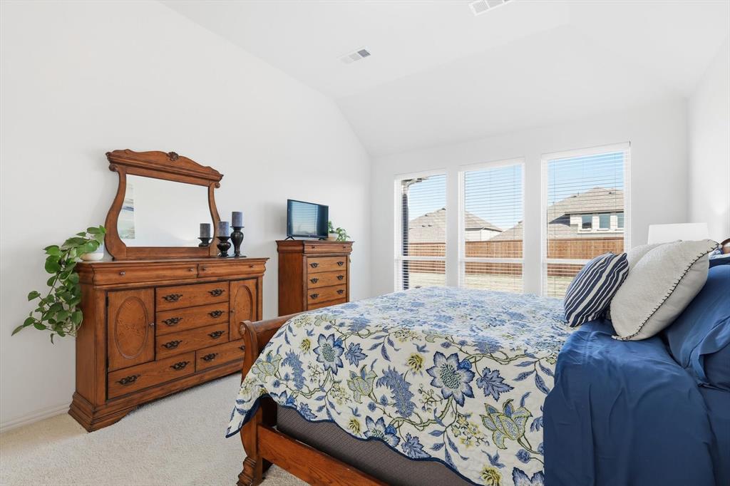 4420 Minnow Cove Oak Point, TX 75068 - Photo 21 of 40 a bedroom with a bed and a desk