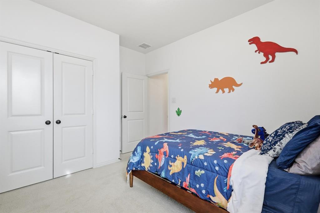 4420 Minnow Cove Oak Point, TX 75068 - Photo 30 of 40 a bedroom with a bed and a window