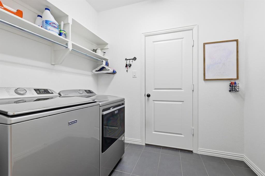 4420 Minnow Cove Oak Point, TX 75068 - Photo 33 of 40 a utility room with dryer and washer