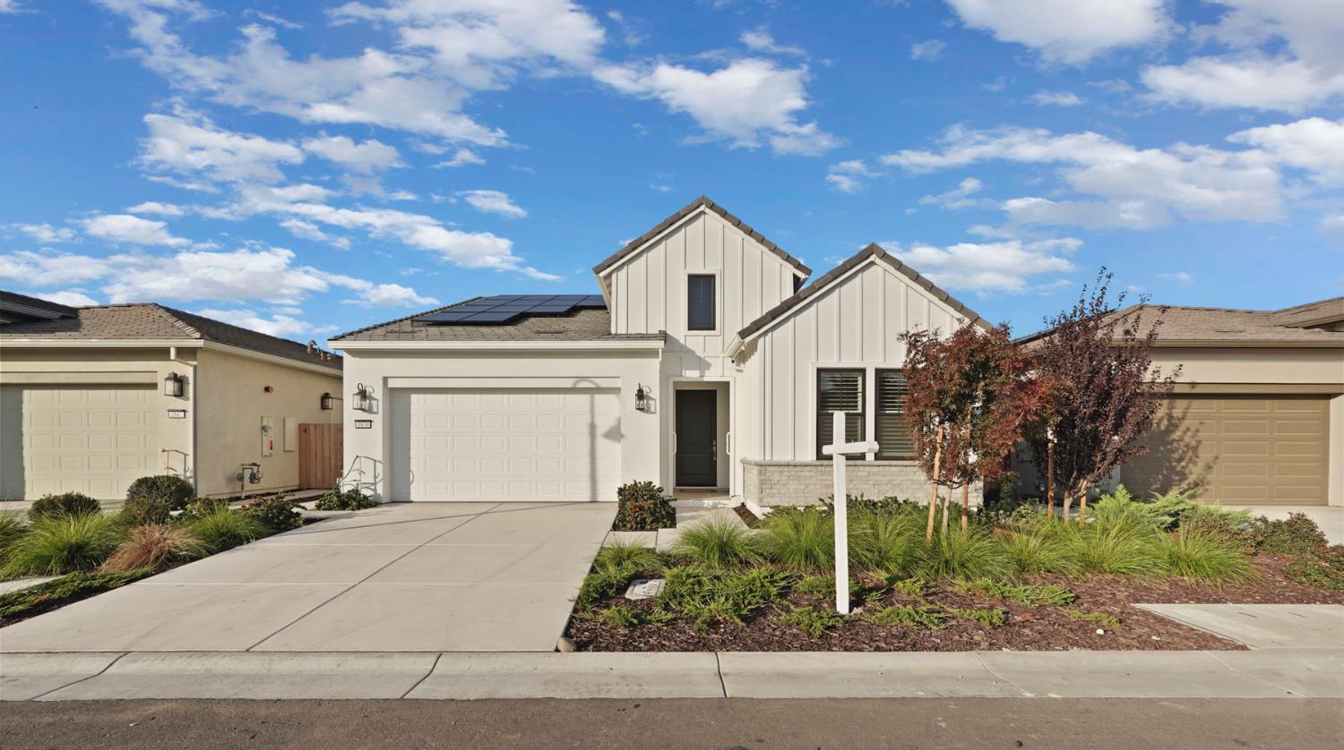 1839 Snowflower Place Tracy, CA 95377 - Photo 1 of 53 a view of a white house next to a road and yard