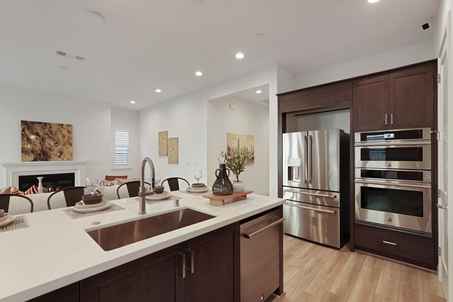 1839 Snowflower Place Tracy, CA 95377 - Photo 11 of 53 a kitchen with cabinets and stainless steel appliances