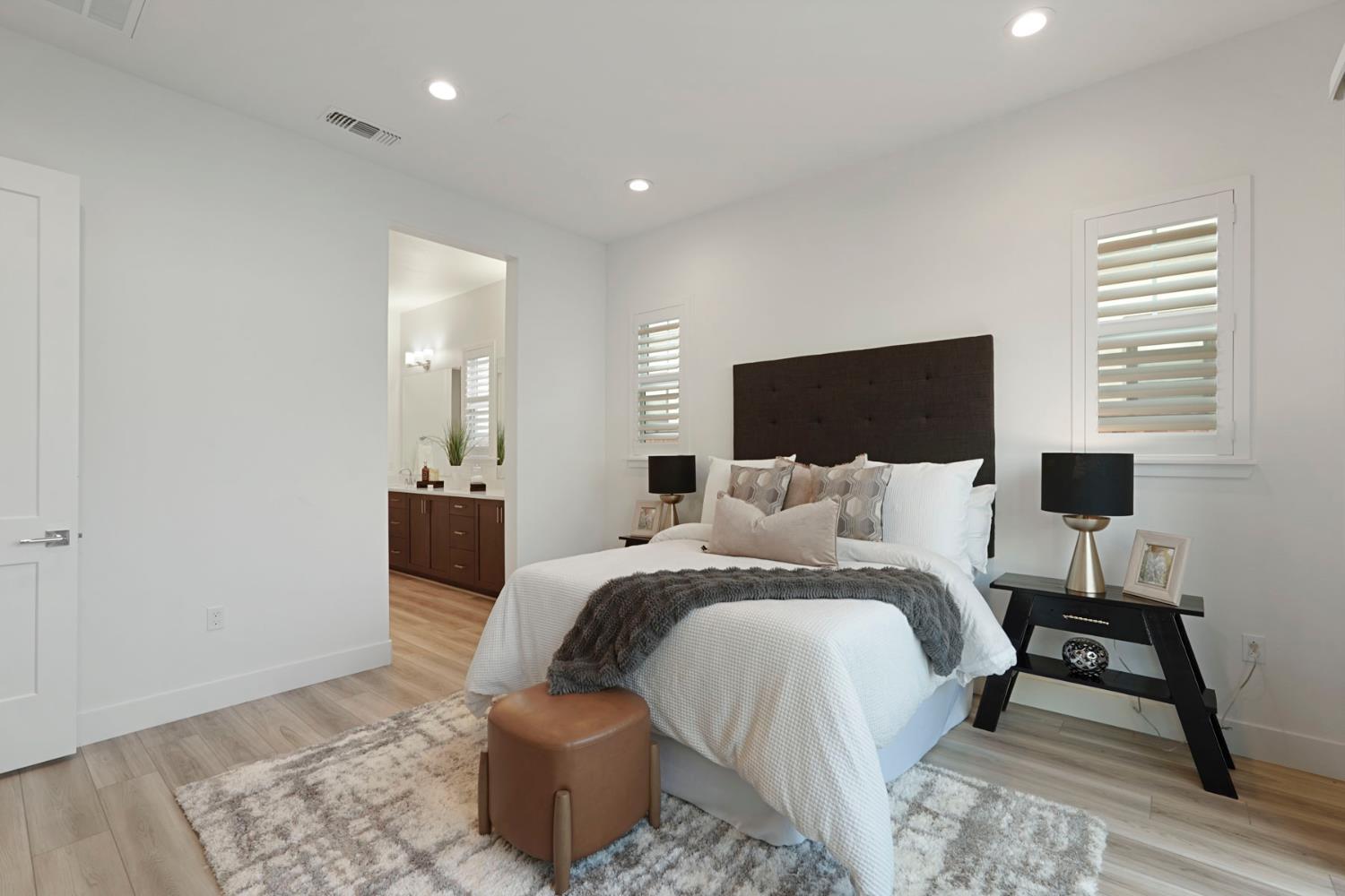 1839 Snowflower Place Tracy, CA 95377 - Photo 15 of 53 a large bedroom with a bed and wooden floor