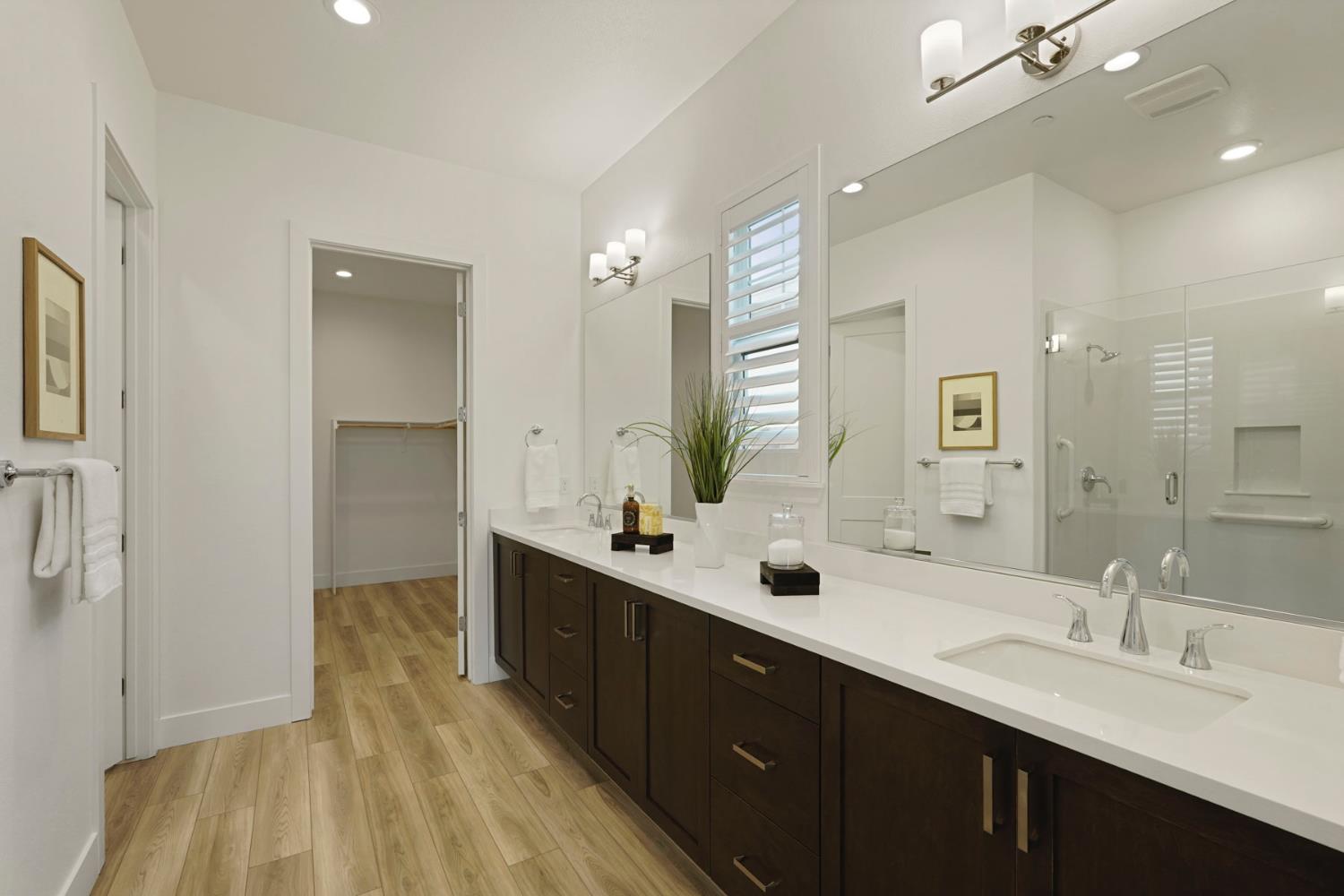 1839 Snowflower Place Tracy, CA 95377 - Photo 17 of 53 a spacious bathroom with a double vanity sink and mirror
