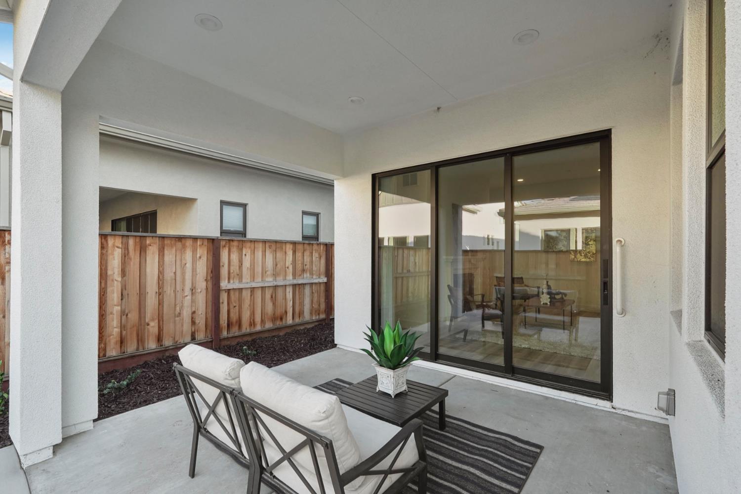 1839 Snowflower Place Tracy, CA 95377 - Photo 27 of 53 a view of a room with furniture and wooden floor