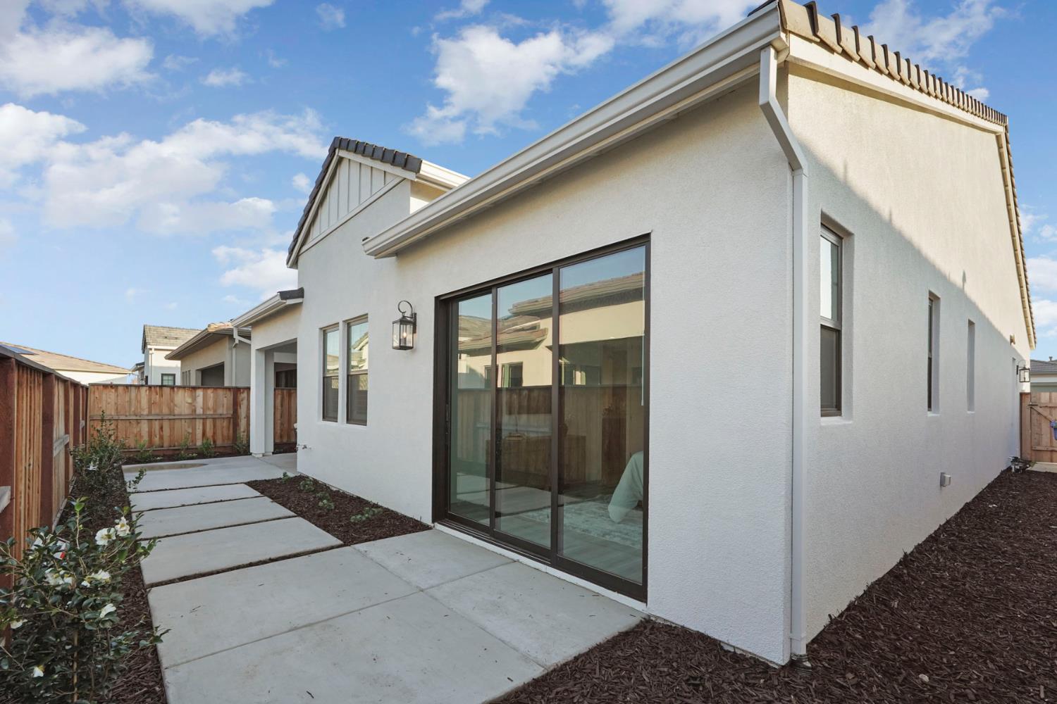 1839 Snowflower Place Tracy, CA 95377 - Photo 30 of 53 a view of a house with a backyard