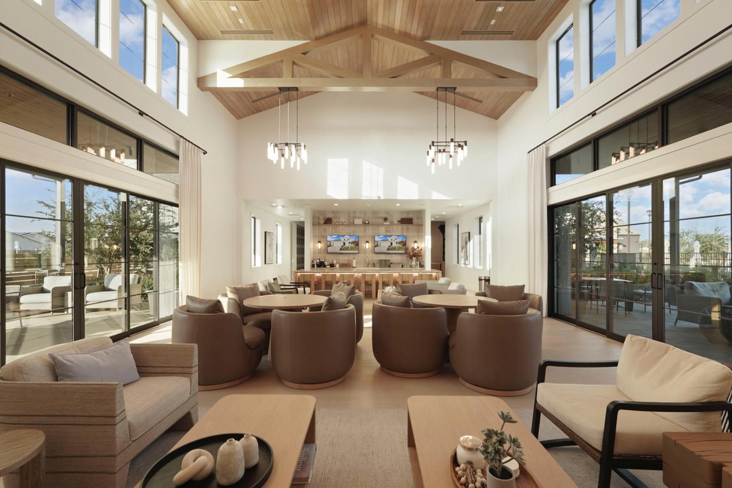 1839 Snowflower Place Tracy, CA 95377 - Photo 35 of 53 a large living room with furniture a chandelier and a large window