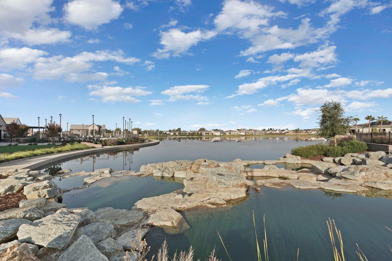 1839 Snowflower Place Tracy, CA 95377 - Photo 49 of 53 a view of a lake with a terrace