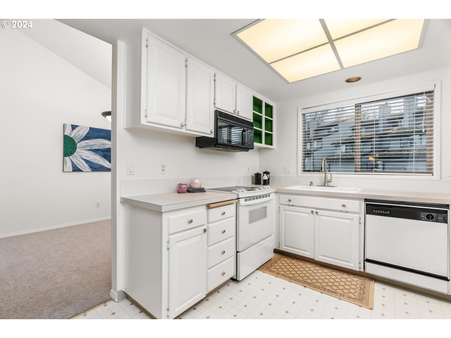 6223 Meridian Circle West Linn, OR 97068 - Photo 17 of 45 a kitchen with cabinets appliances a sink and a window