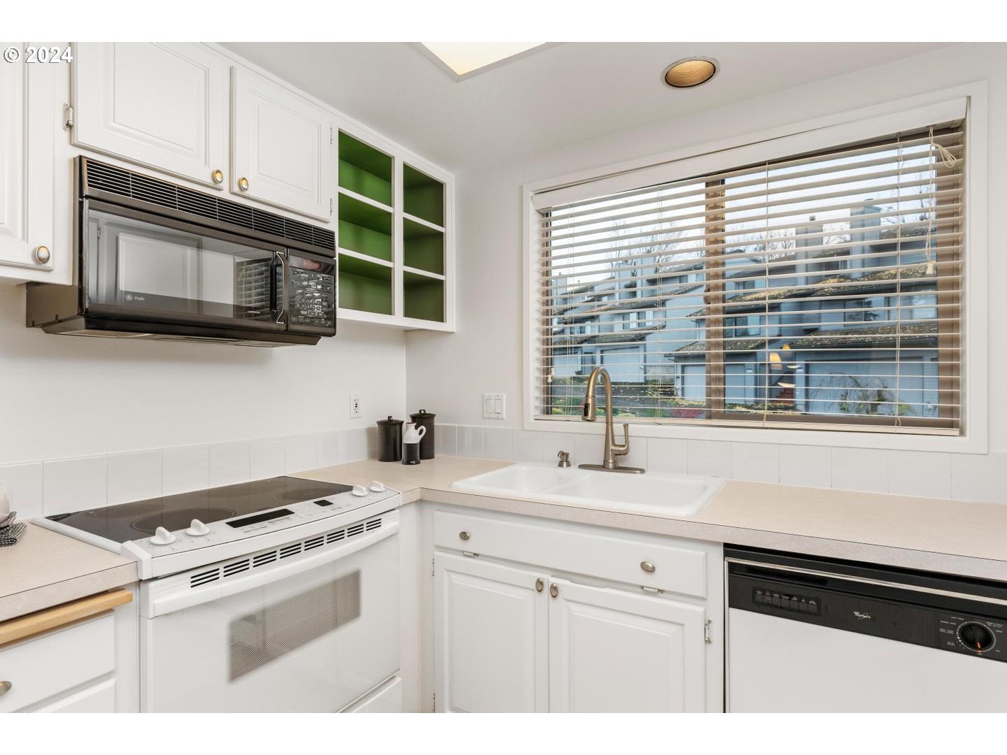 6223 Meridian Circle West Linn, OR 97068 - Photo 19 of 45 a kitchen with stainless steel appliances a stove sink and microwave