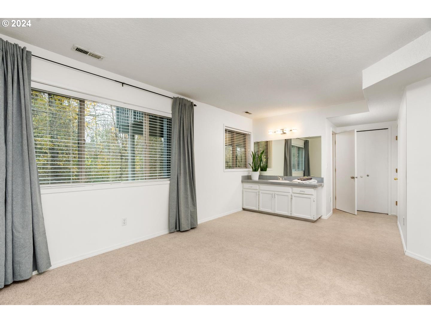 6223 Meridian Circle West Linn, OR 97068 - Photo 30 of 45 a room with a bed and a large window