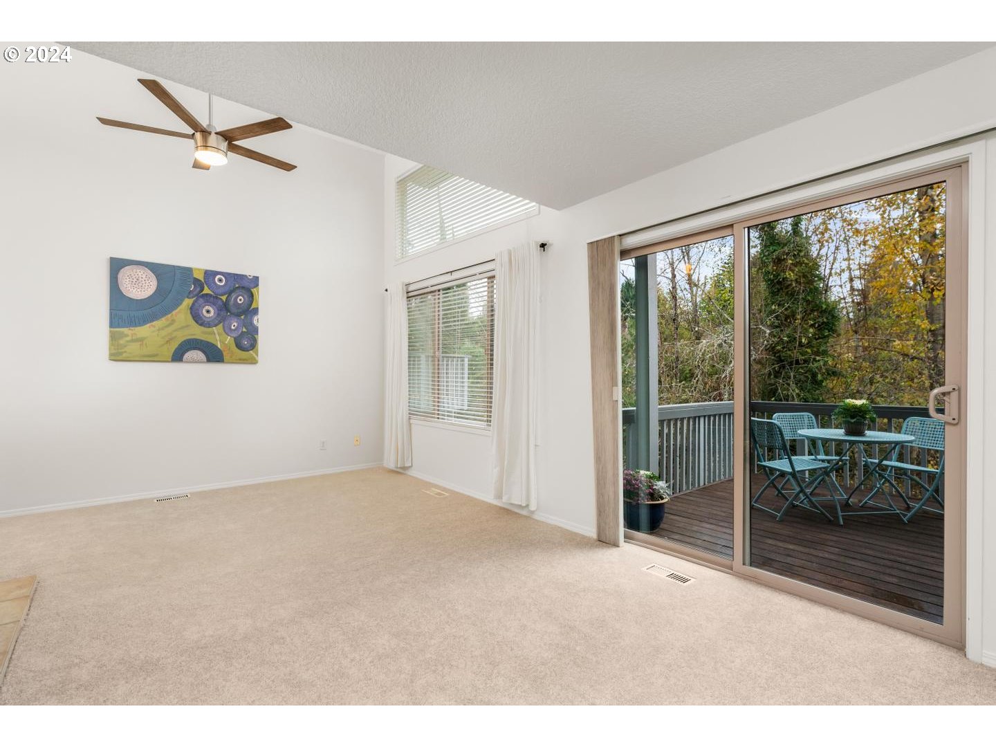 6223 Meridian Circle West Linn, OR 97068 - Photo 9 of 45 a view of an empty room with a floor to ceiling window and a ceiling fan