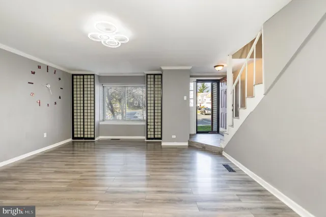 a view of an entryway with wooden floor
