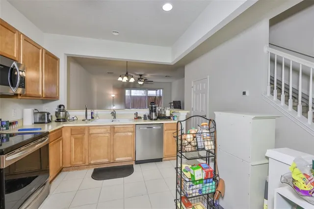 a kitchen with stainless steel appliances granite countertop a sink and cabinets