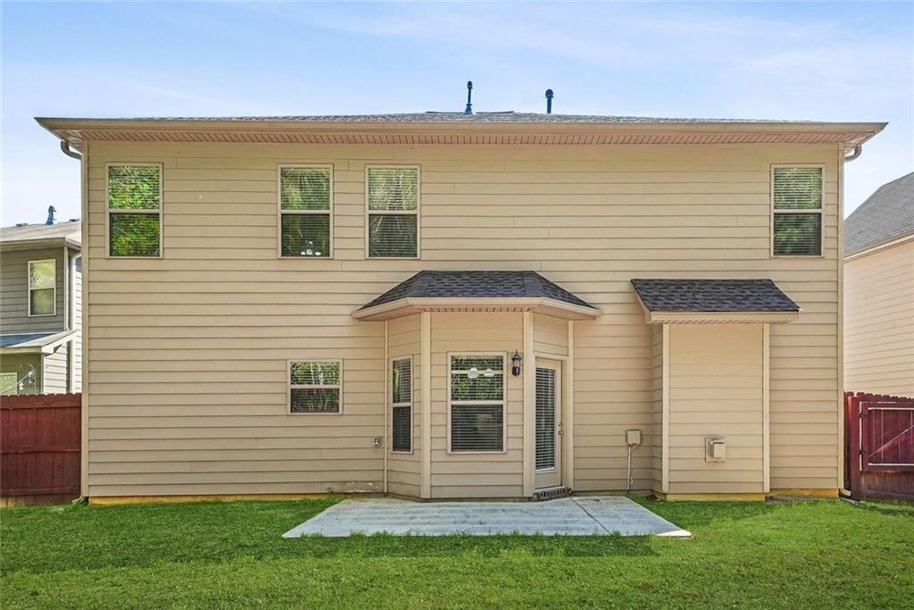 7823 Shertall Road Fairburn, GA 30213 - Photo 27 of 40 a front view of a house with a garden