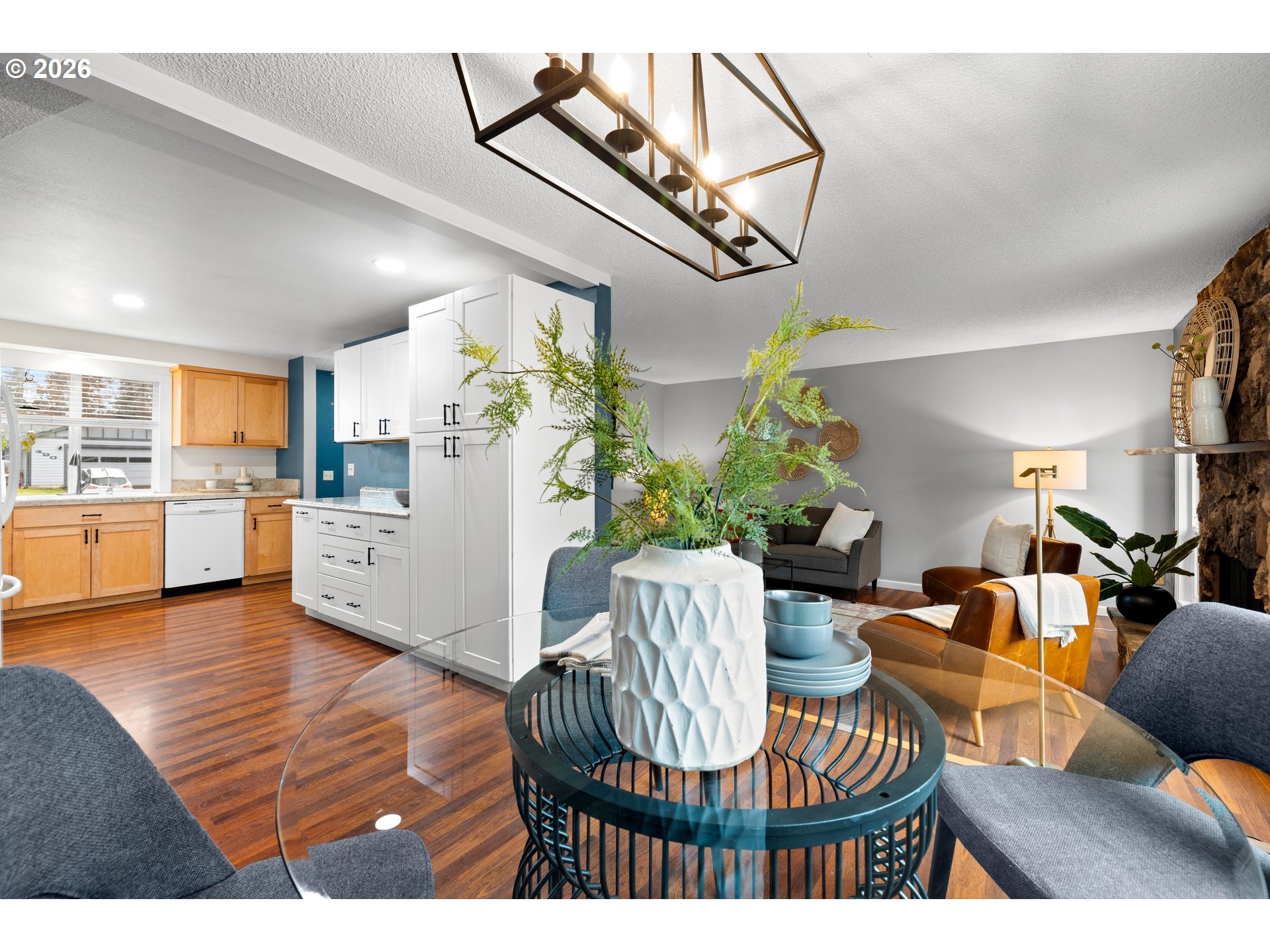 493 South Emerald Loop Cornelius, OR 97113 - Photo 11 of 46 a living room with furniture kitchen view and a chandelier