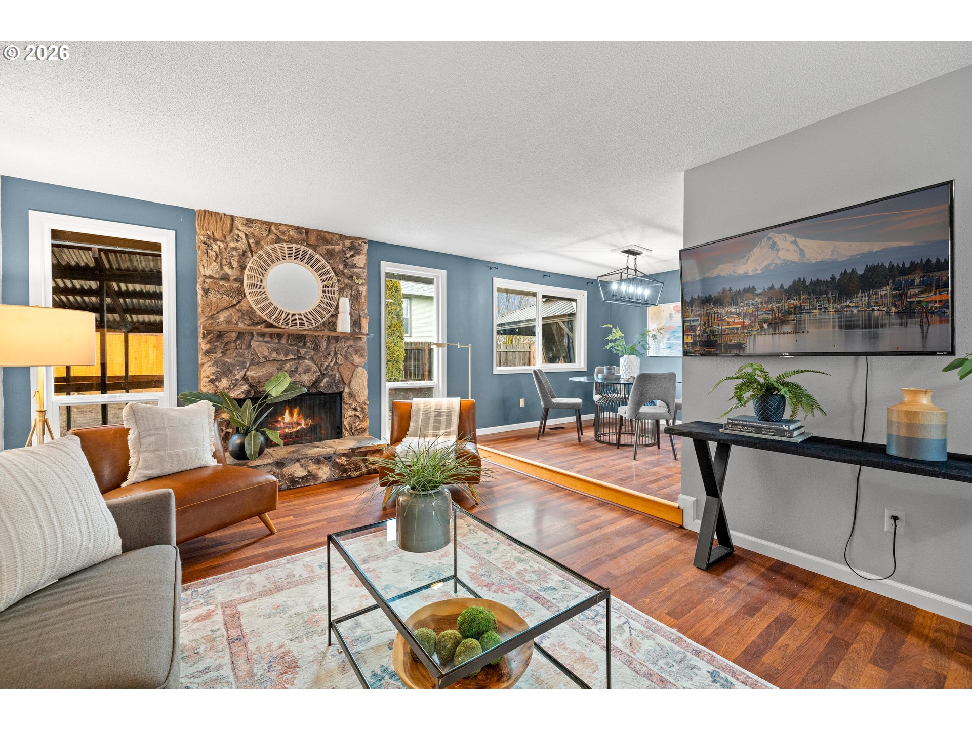 493 South Emerald Loop Cornelius, OR 97113 - Photo 14 of 46 a living room with fireplace furniture and a large window