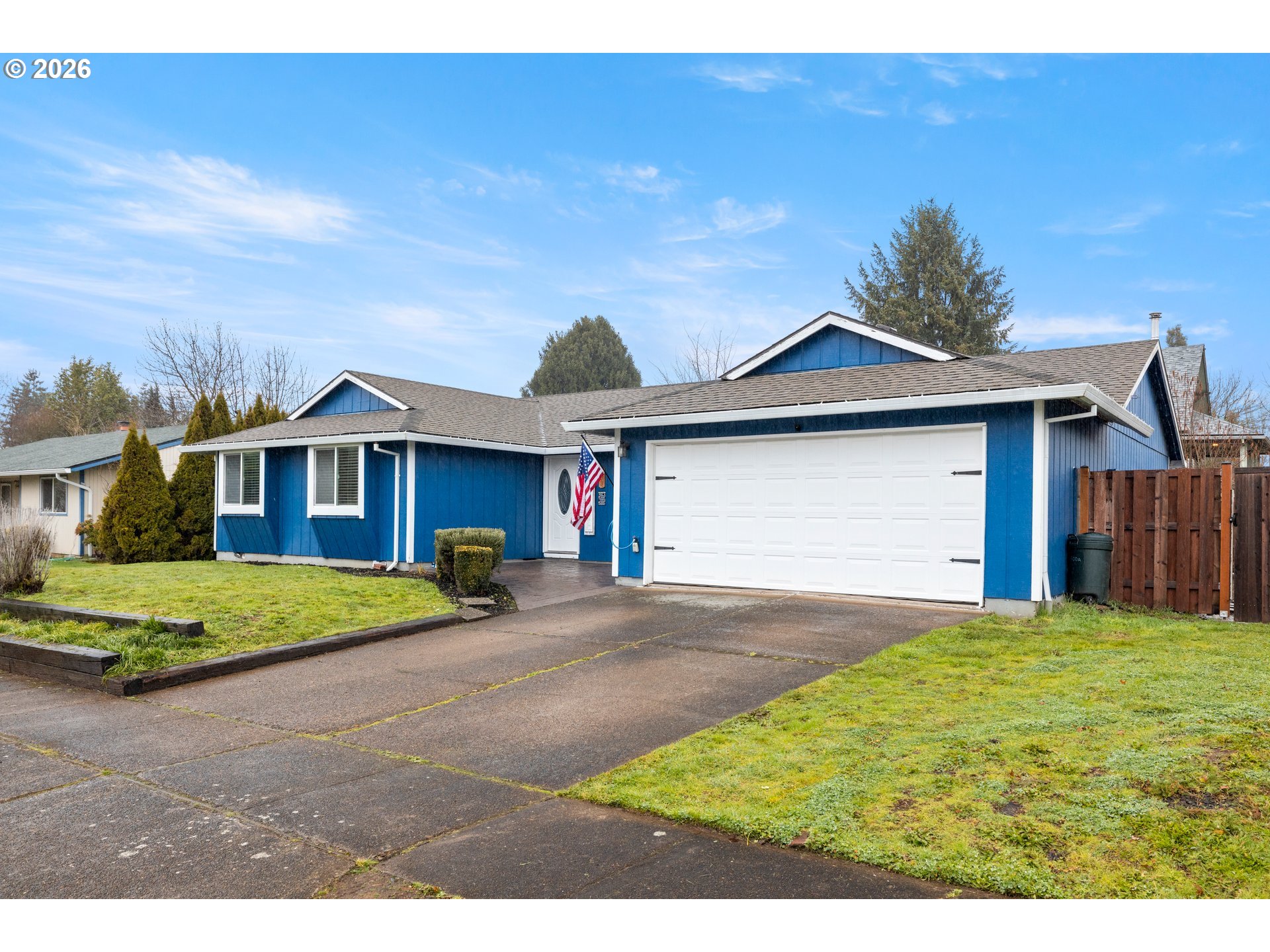 493 South Emerald Loop Cornelius, OR 97113 - Photo 2 of 46 a front view of a house with a yard and garage
