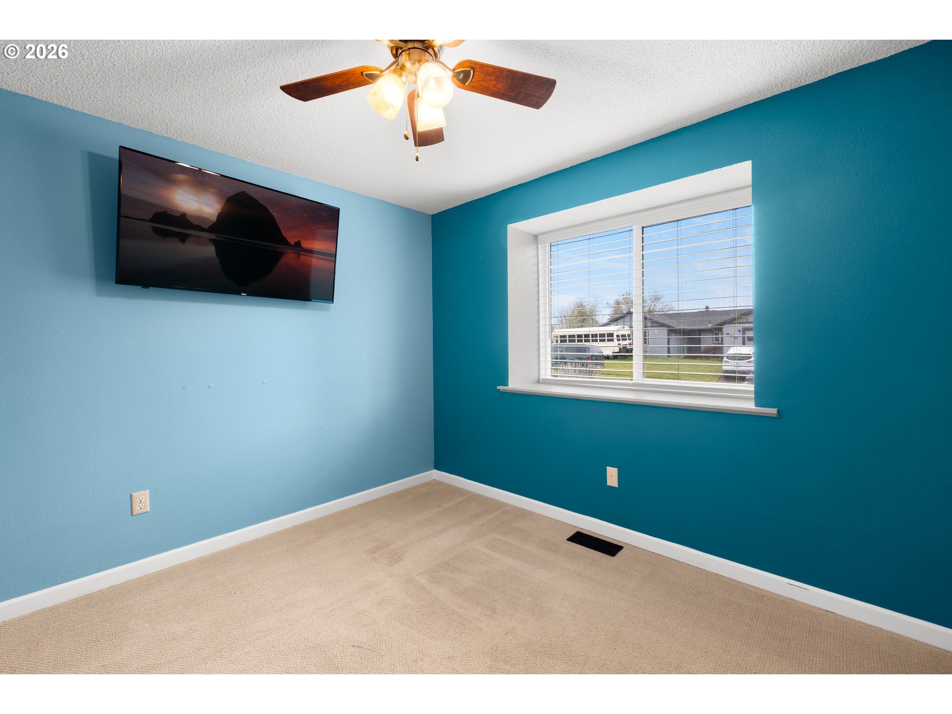 493 South Emerald Loop Cornelius, OR 97113 - Photo 27 of 46 a view of an empty room with window and ceiling fan