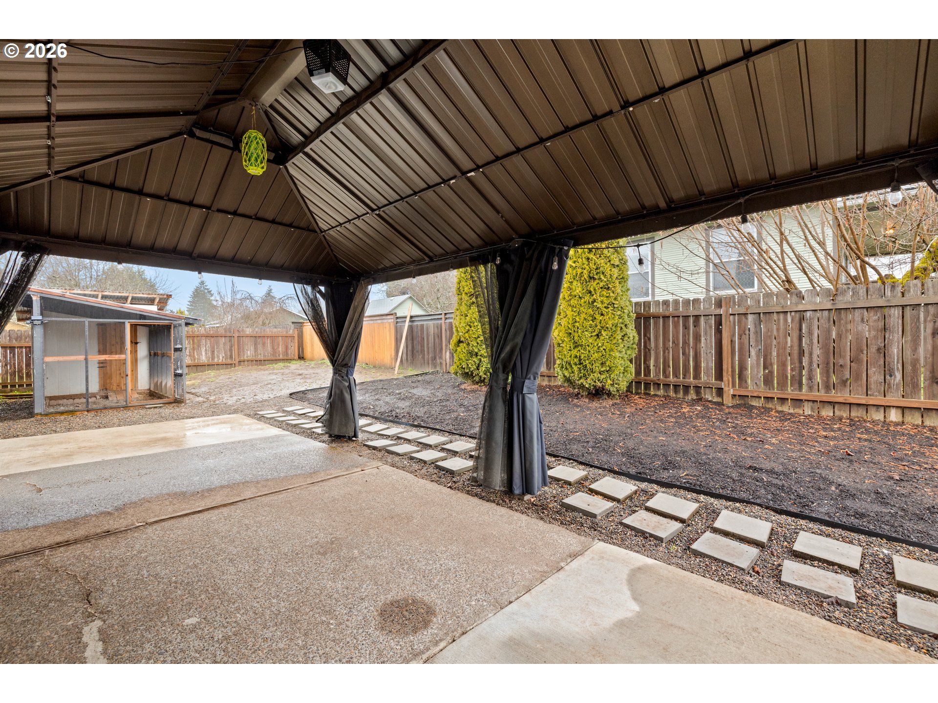 493 South Emerald Loop Cornelius, OR 97113 - Photo 36 of 46 a view of a backyard with wooden fence