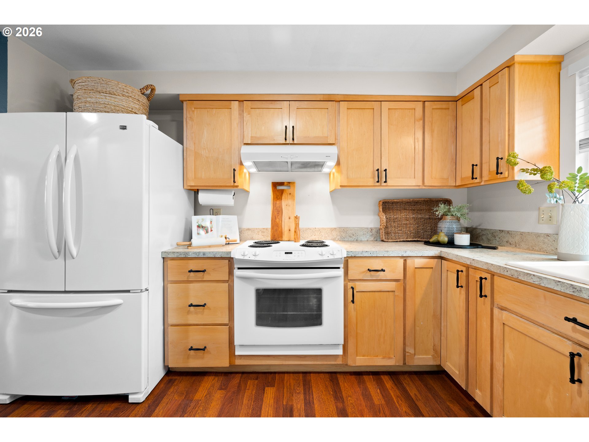 493 South Emerald Loop Cornelius, OR 97113 - Photo 4 of 46 a kitchen with a refrigerator sink and cabinets