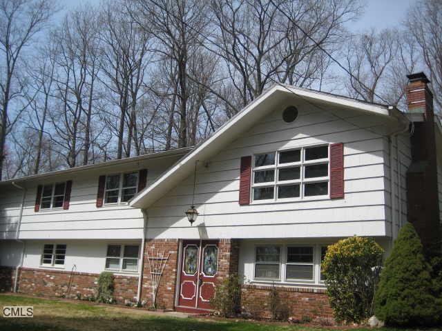 30 West Mischa Road Trumbull, CT 06611 - Photo 1 of 1 a front view of a house with garden
