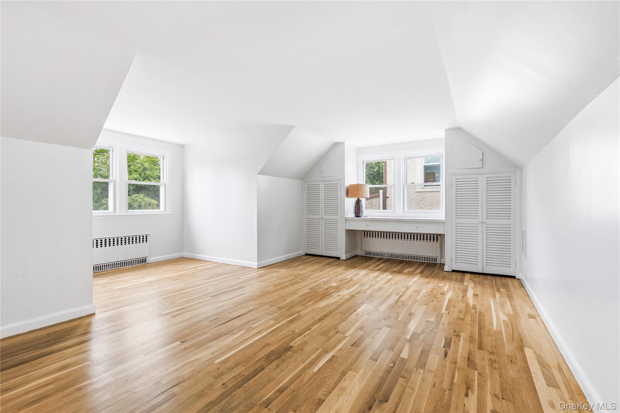46 Mathews Street Harrison, NY 10528 - Photo 17 of 30 wooden floor in an empty room with a window