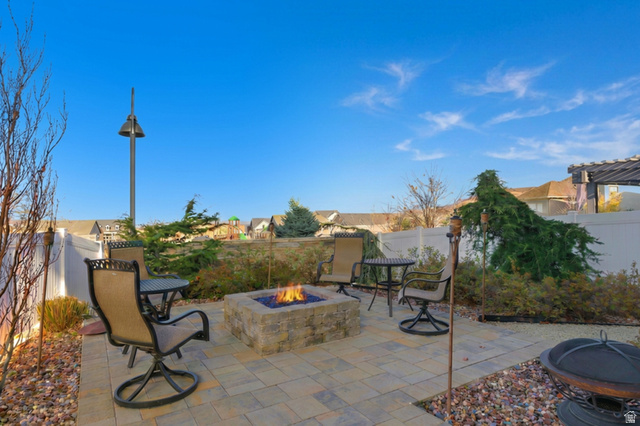 987 East Deer Arch Lane Draper, UT 84020 - Photo 43 of 46 Back patio within a fenced backyard and gas fire pit