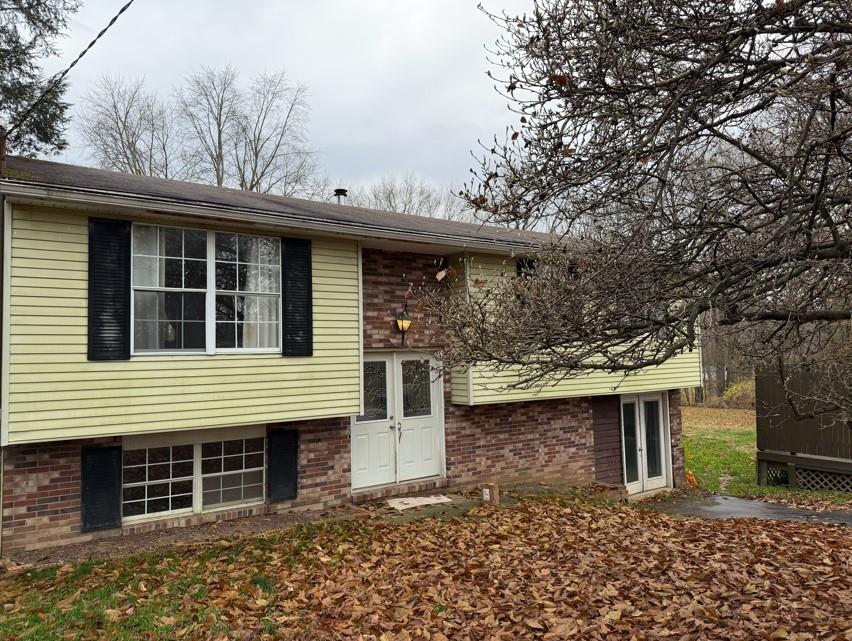 3366 Frew Mill Road New Castle, PA 16101 - Photo 1 of 10 a front view of a house with garden