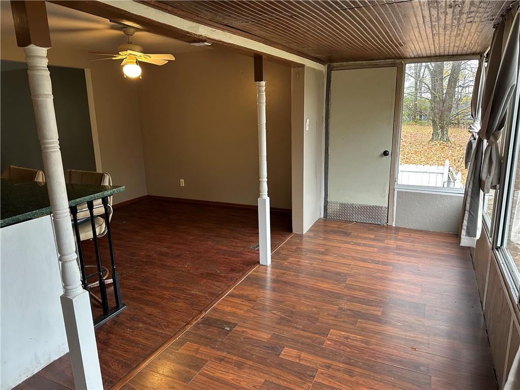 3366 Frew Mill Road New Castle, PA 16101 - Photo 4 of 10 wooden floor in an empty room with a window