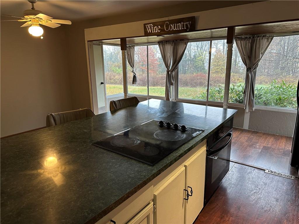 3366 Frew Mill Road New Castle, PA 16101 - Photo 6 of 10 a kitchen with a stove a sink and a granite counter top