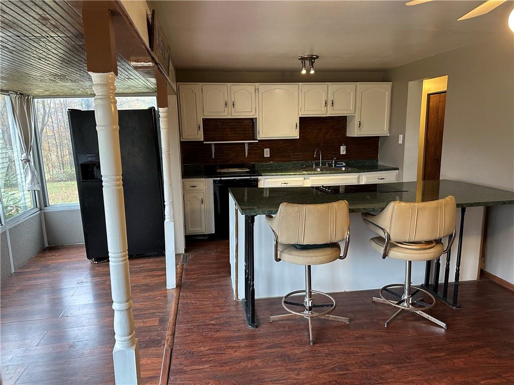 3366 Frew Mill Road New Castle, PA 16101 - Photo 7 of 10 a view of kitchen with refrigerator microwave and cabinets