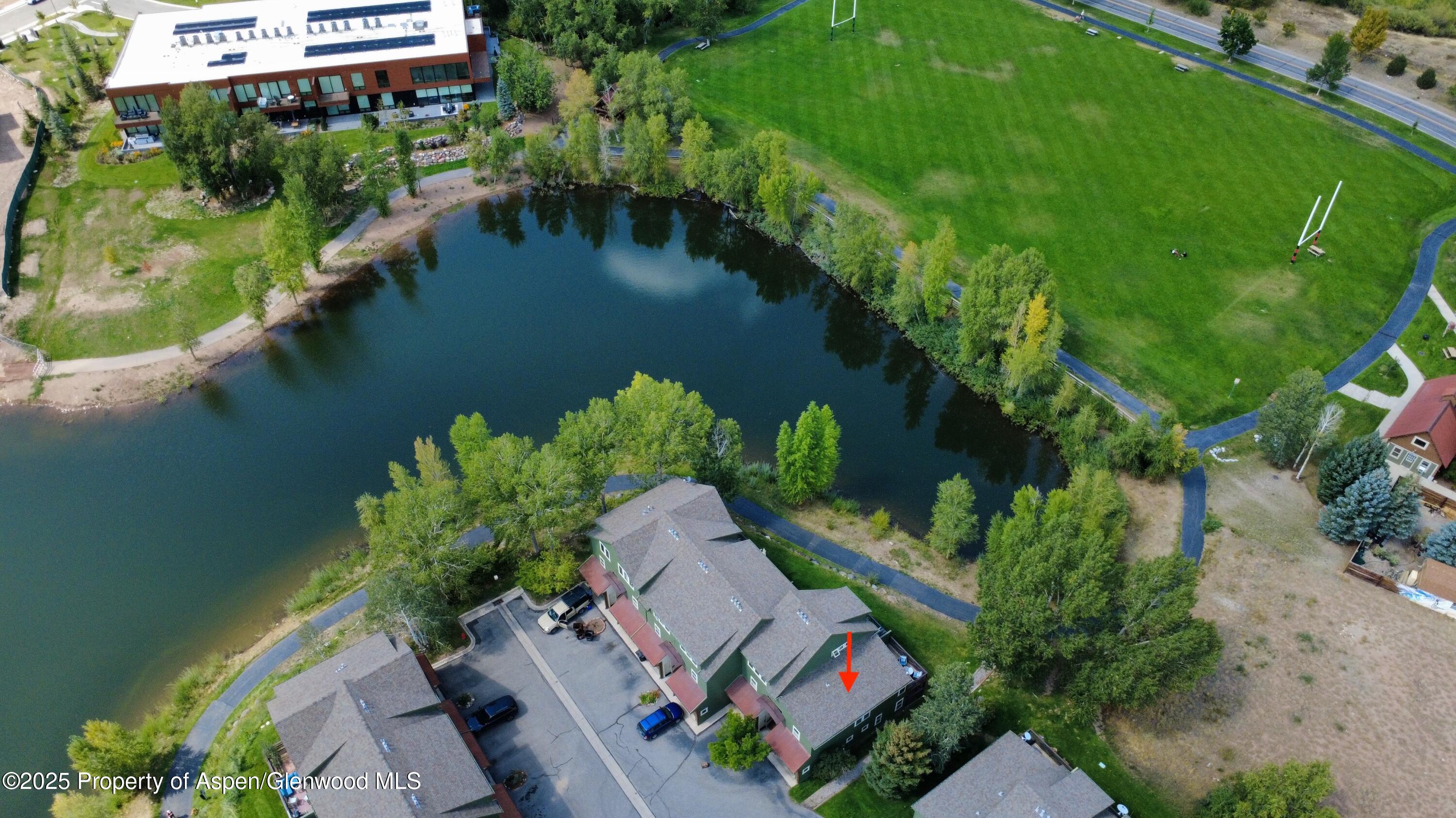 200 Lakeside Court Basalt, CO 81621 - Photo 21 of 23 an aerial view of a house with garden space and a lake view