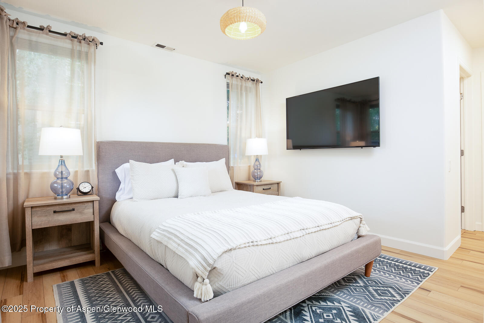 200 Lakeside Court Basalt, CO 81621 - Photo 8 of 23 a bedroom with a bed and a flat screen tv