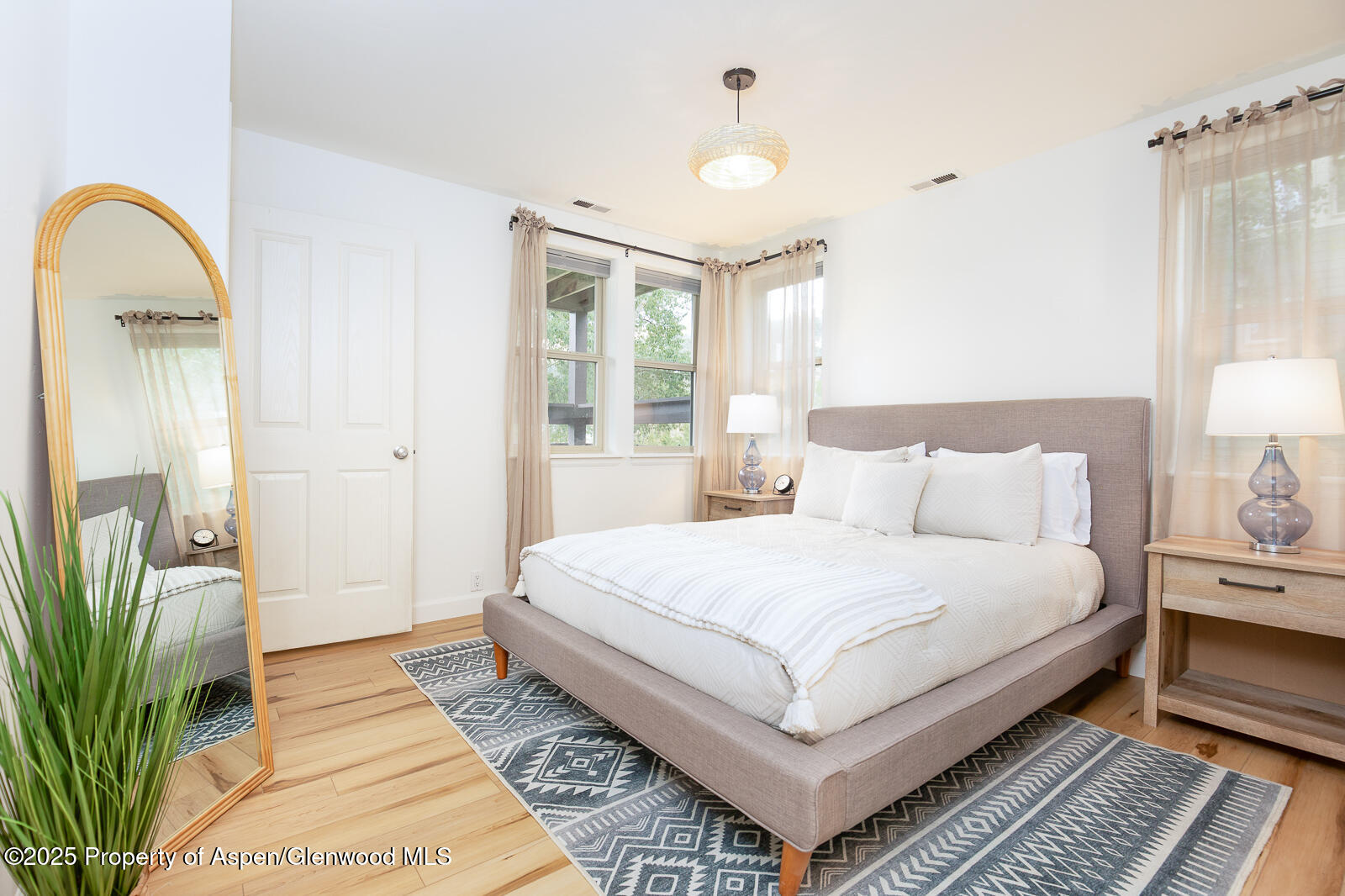 200 Lakeside Court Basalt, CO 81621 - Photo 9 of 23 a bedroom with a large bed and a potted plant