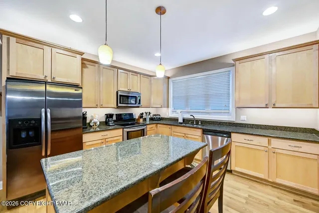 a outdoor space with patio furniture and a fireplace