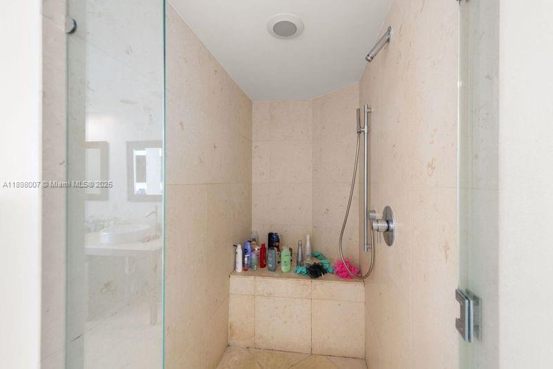465 Brickell Avenue, Unit 1602 Miami, FL 33131 - Photo 13 of 30 a bathroom with a shower and a sink