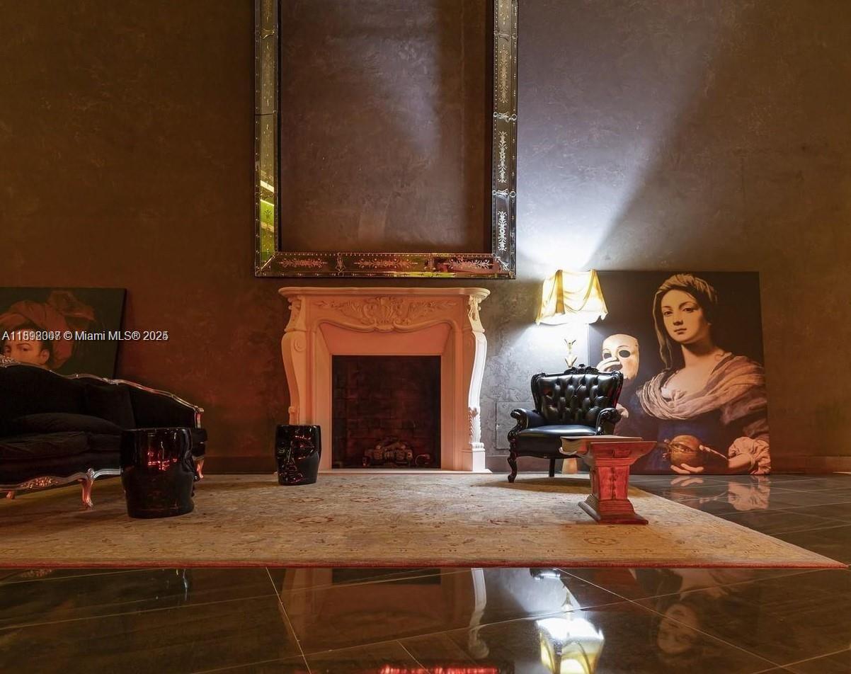 465 Brickell Avenue, Unit 1602 Miami, FL 33131 - Photo 26 of 30 a living room with furniture and a fireplace