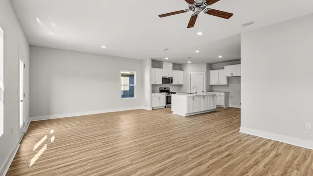 a view of kitchen with wooden floor and window
