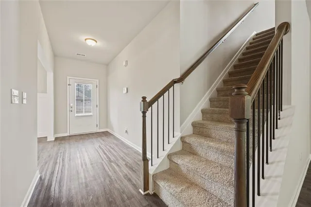 a view of entryway with wooden floor