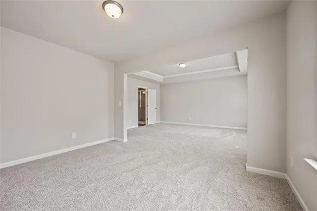 a bathroom with a granite countertop sink a large mirror and a shower