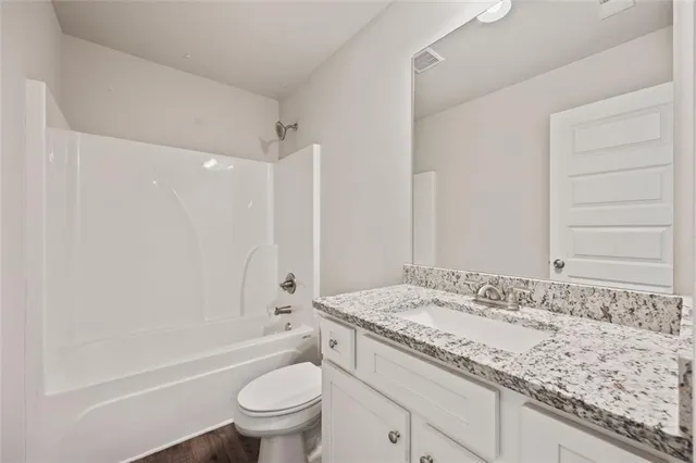 a view of a house with a yard and fence