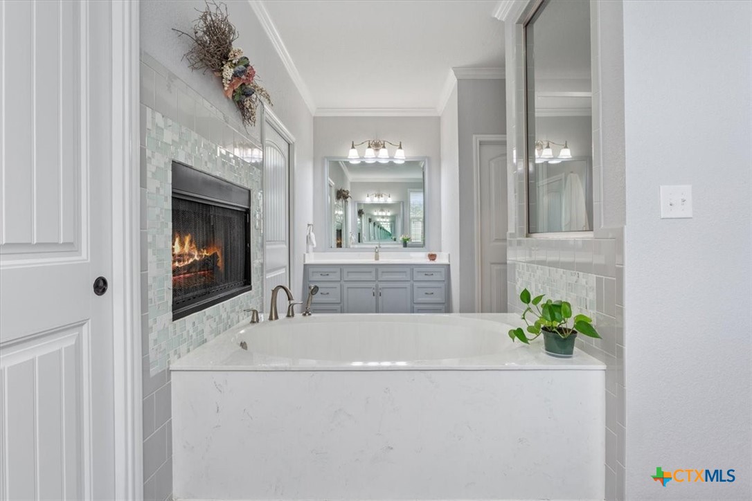 645 West Big Elm Road Troy, TX 76579 - Photo 16 of 37 a bathroom with a bathtub and a sink